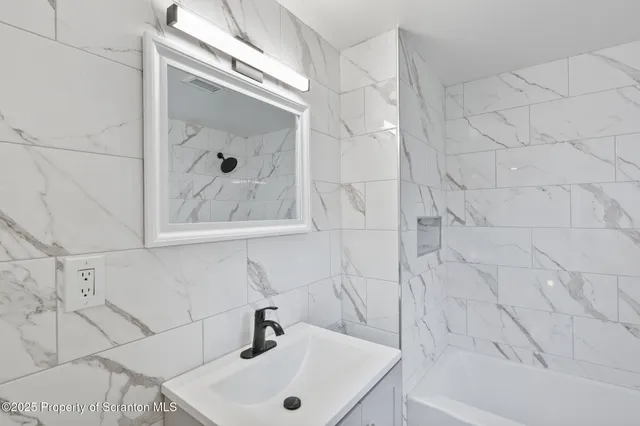 a bathroom with a sink and a bathtub