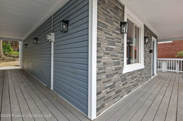a view of a brick house with wooden floor