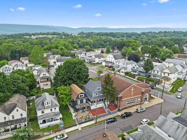 an aerial view of a city with lots of residential buildings