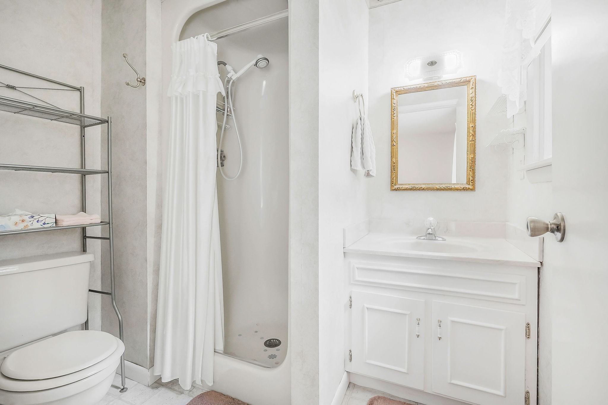 5036 Pendergrass Road Byrdstown, TN 38549 - Photo 18 of 38 a bathroom with a toilet a sink a vanity and mirror