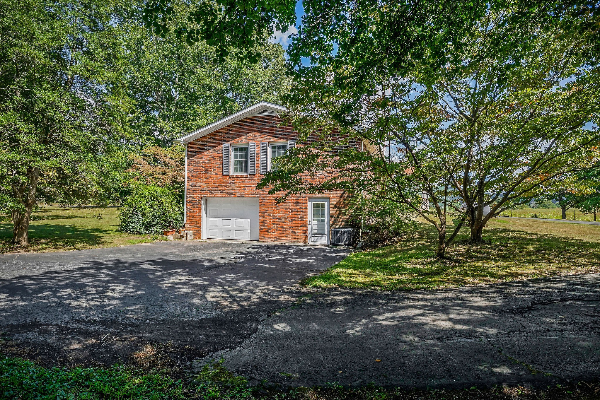 5036 Pendergrass Road Byrdstown, TN 38549 - Photo 37 of 38 a front view of a house with a yard and garage