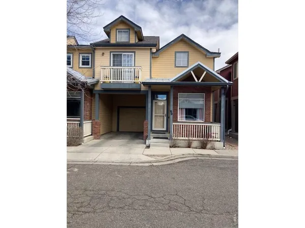 a front view of a house with garage