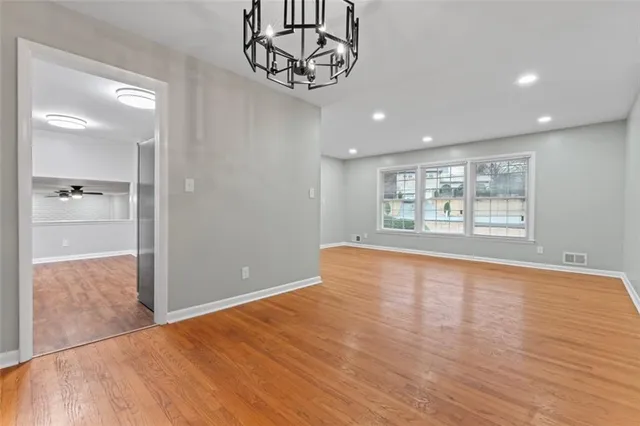 a kitchen with stainless steel appliances granite countertop a refrigerator stove and sink