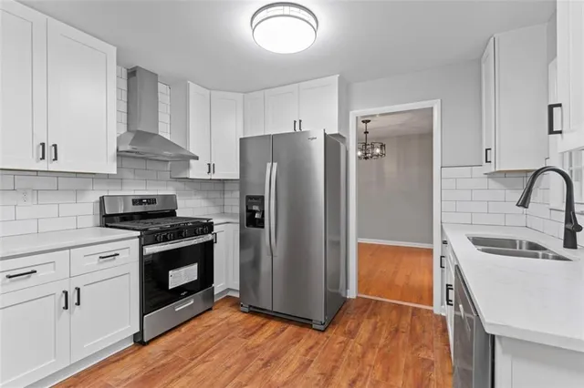 a view of bathroom with staircase and wooden floor