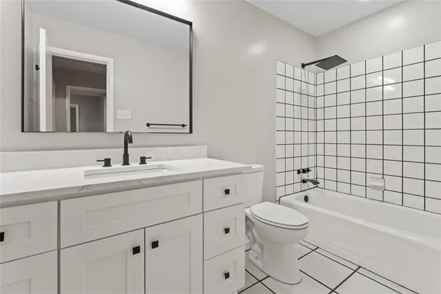 a view of room with a ceiling fan and wooden floor