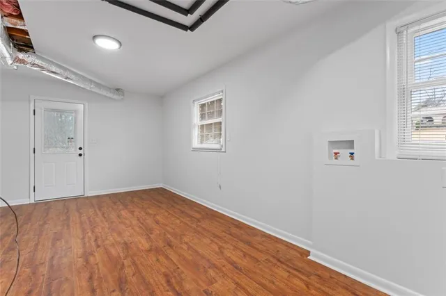 a view of a room with porch and wooden floor