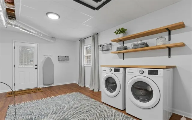 a living room with patio furniture and a floor to ceiling window