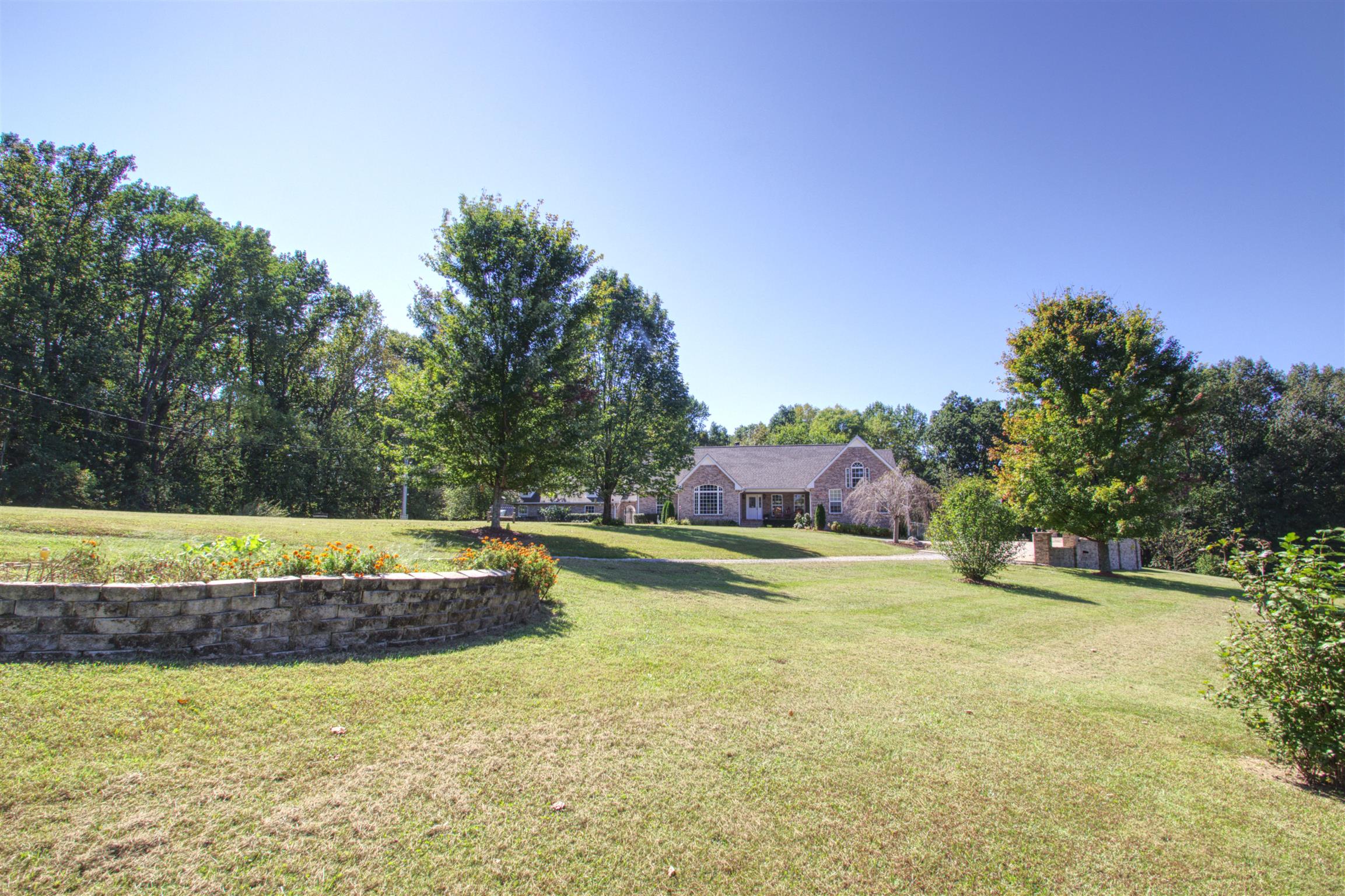 7177 Hall Road Greenbrier, TN 37073 - Photo 1 of 30 a view of a house with swimming pool and a yard