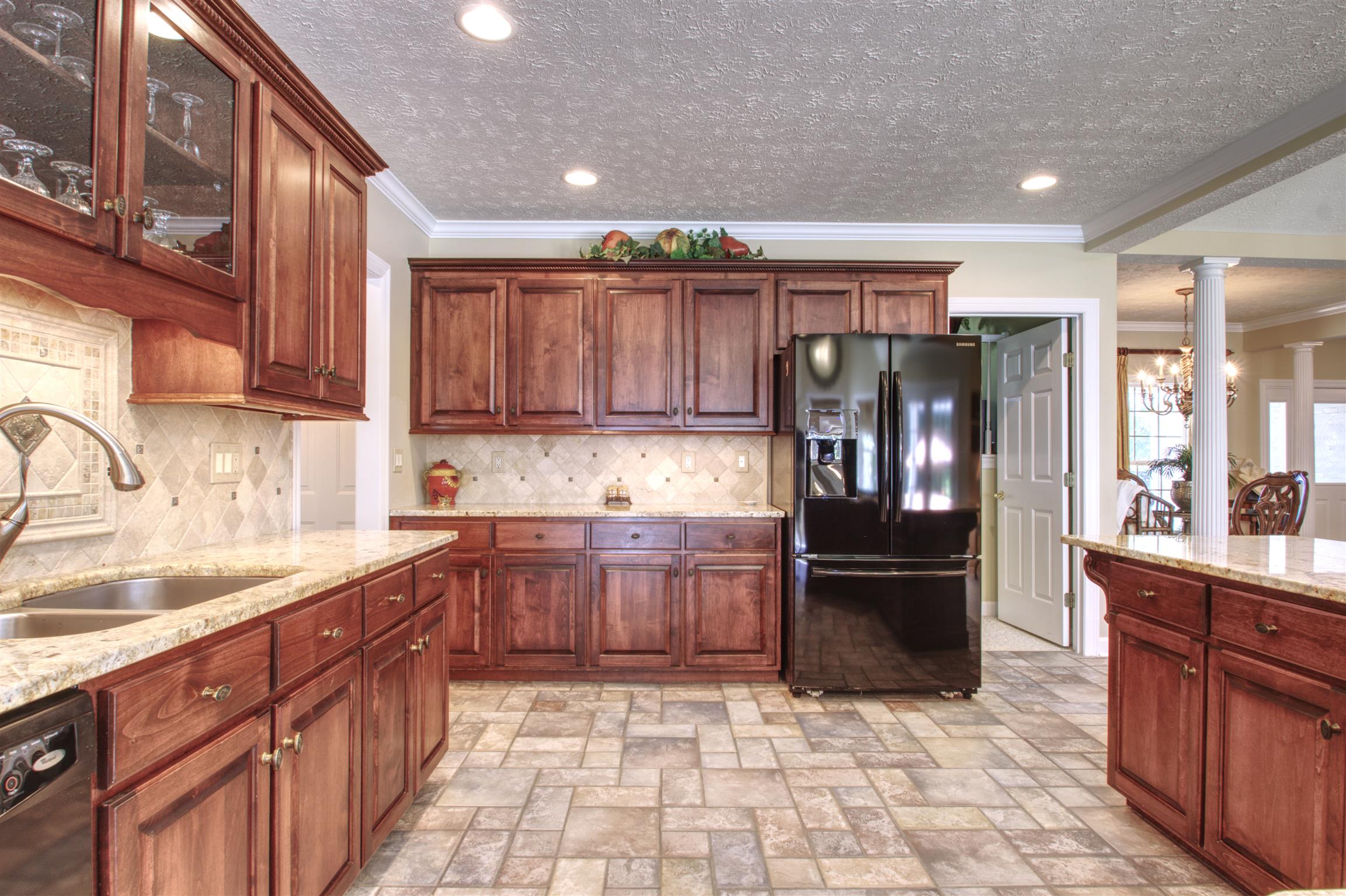7177 Hall Road Greenbrier, TN 37073 - Photo 12 of 30 a kitchen with stainless steel appliances granite countertop a refrigerator and cabinets