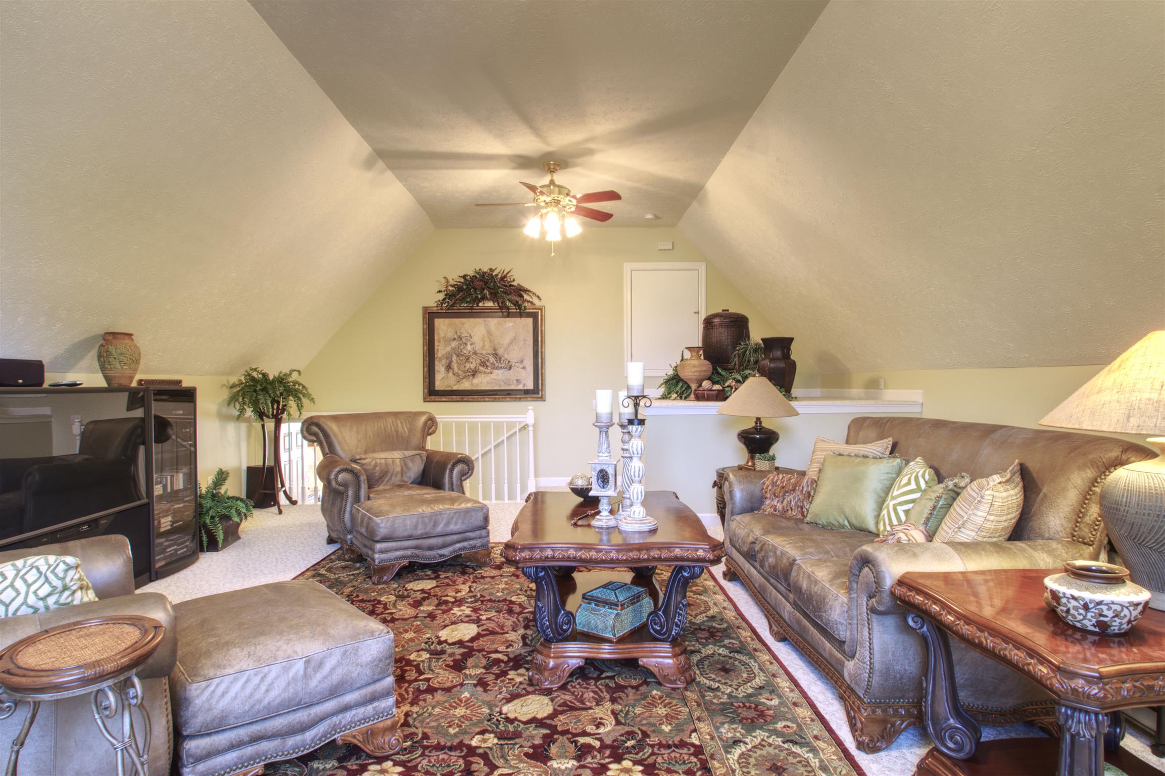 7177 Hall Road Greenbrier, TN 37073 - Photo 15 of 30 a living room with furniture a chandelier and a rug