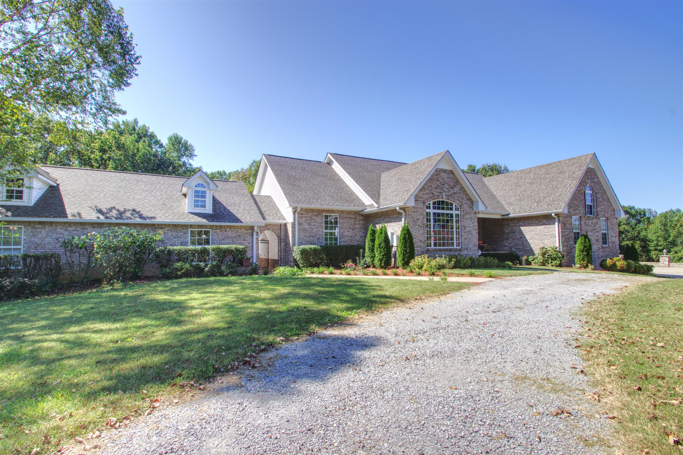 7177 Hall Road Greenbrier, TN 37073 - Photo 2 of 30 a front view of a house with a yard and garage