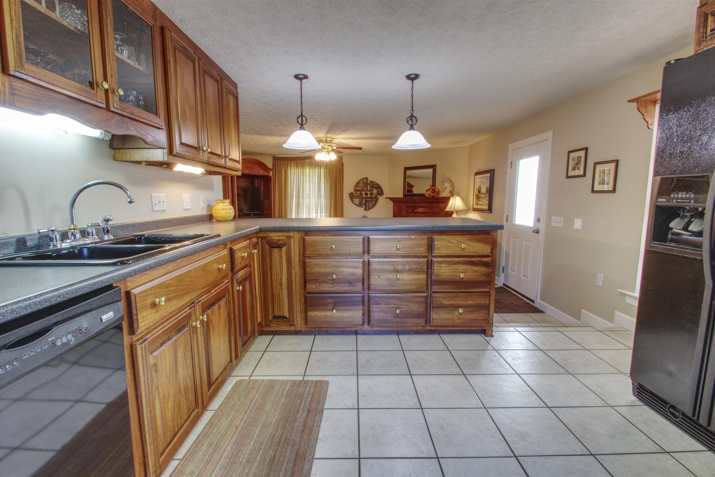 7177 Hall Road Greenbrier, TN 37073 - Photo 28 of 30 a kitchen with stainless steel appliances a sink stove and cabinets