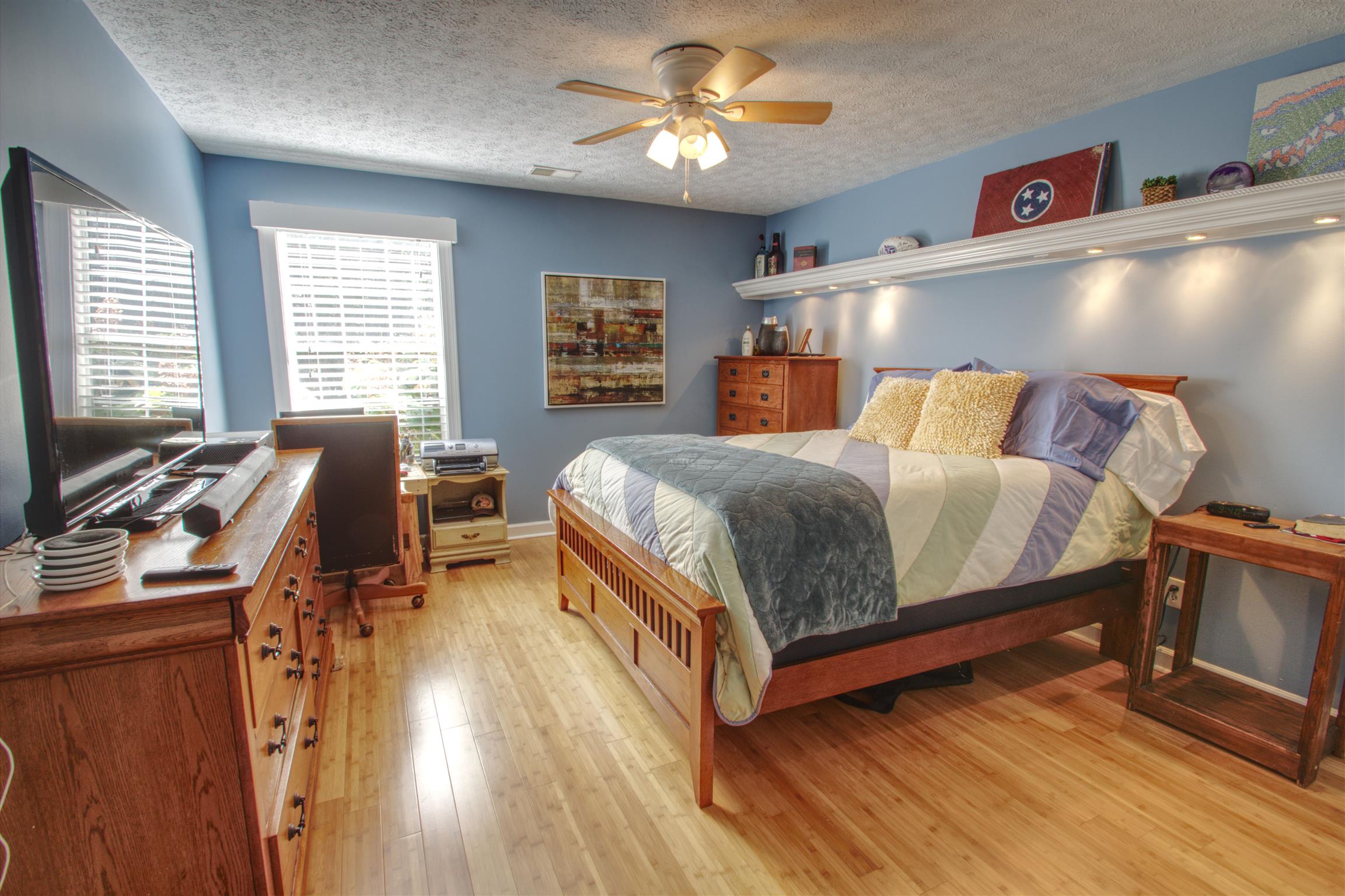 7177 Hall Road Greenbrier, TN 37073 - Photo 30 of 30 a bedroom with a bed and wooden floor