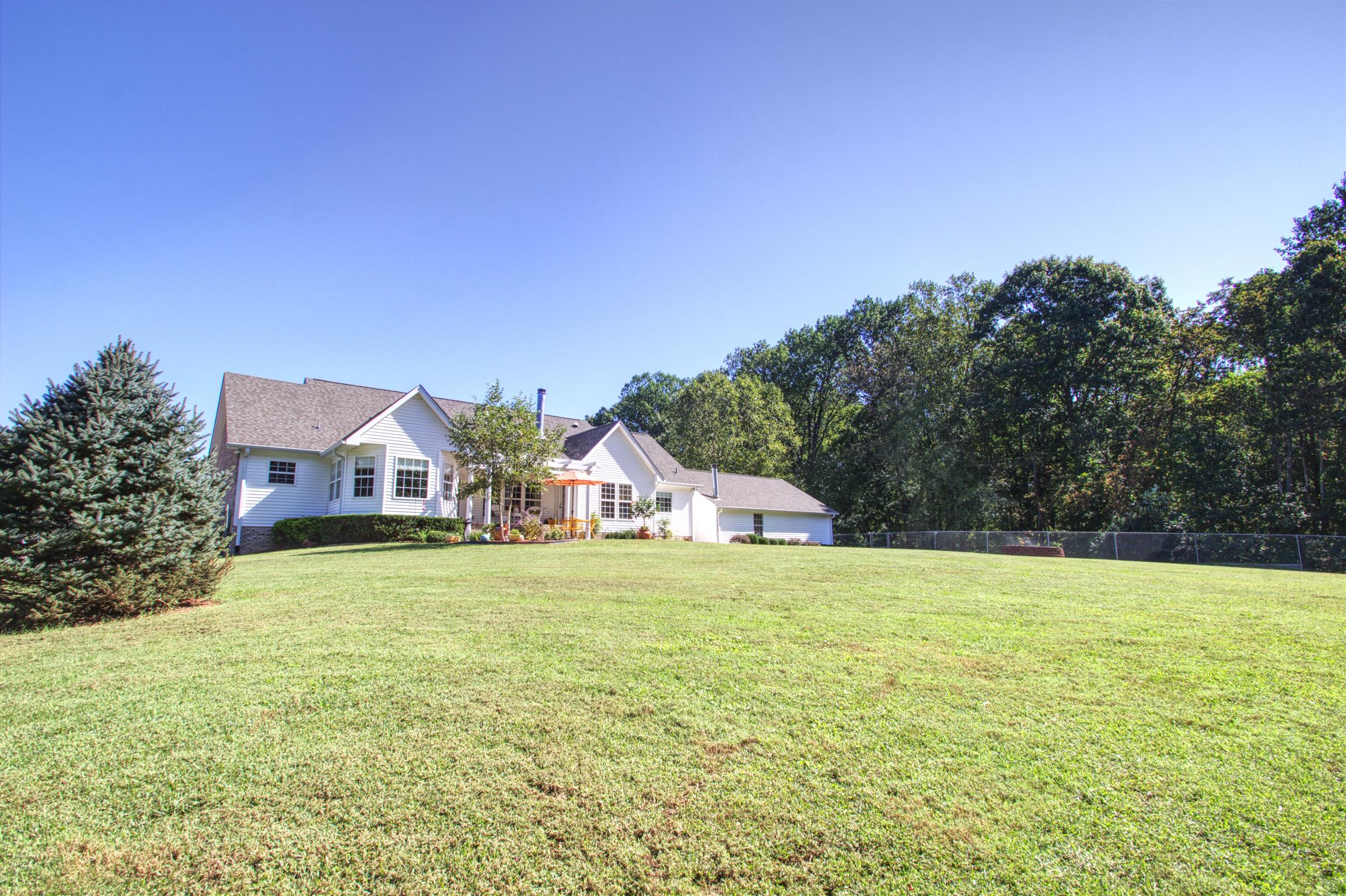 7177 Hall Road Greenbrier, TN 37073 - Photo 5 of 30 a view of house with yard and trees in the background