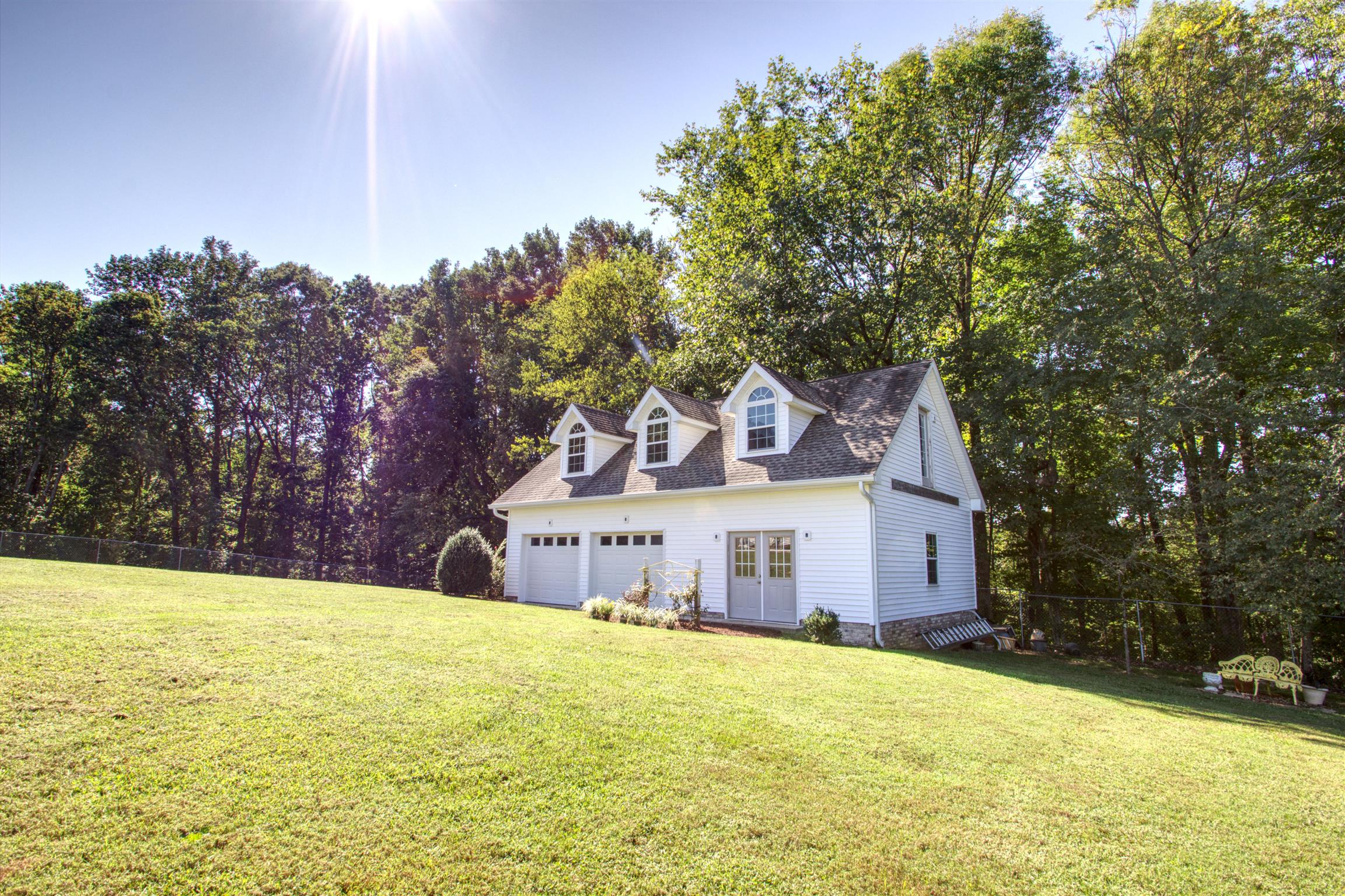 7177 Hall Road Greenbrier, TN 37073 - Photo 6 of 30 a front view of a house with yard and trees