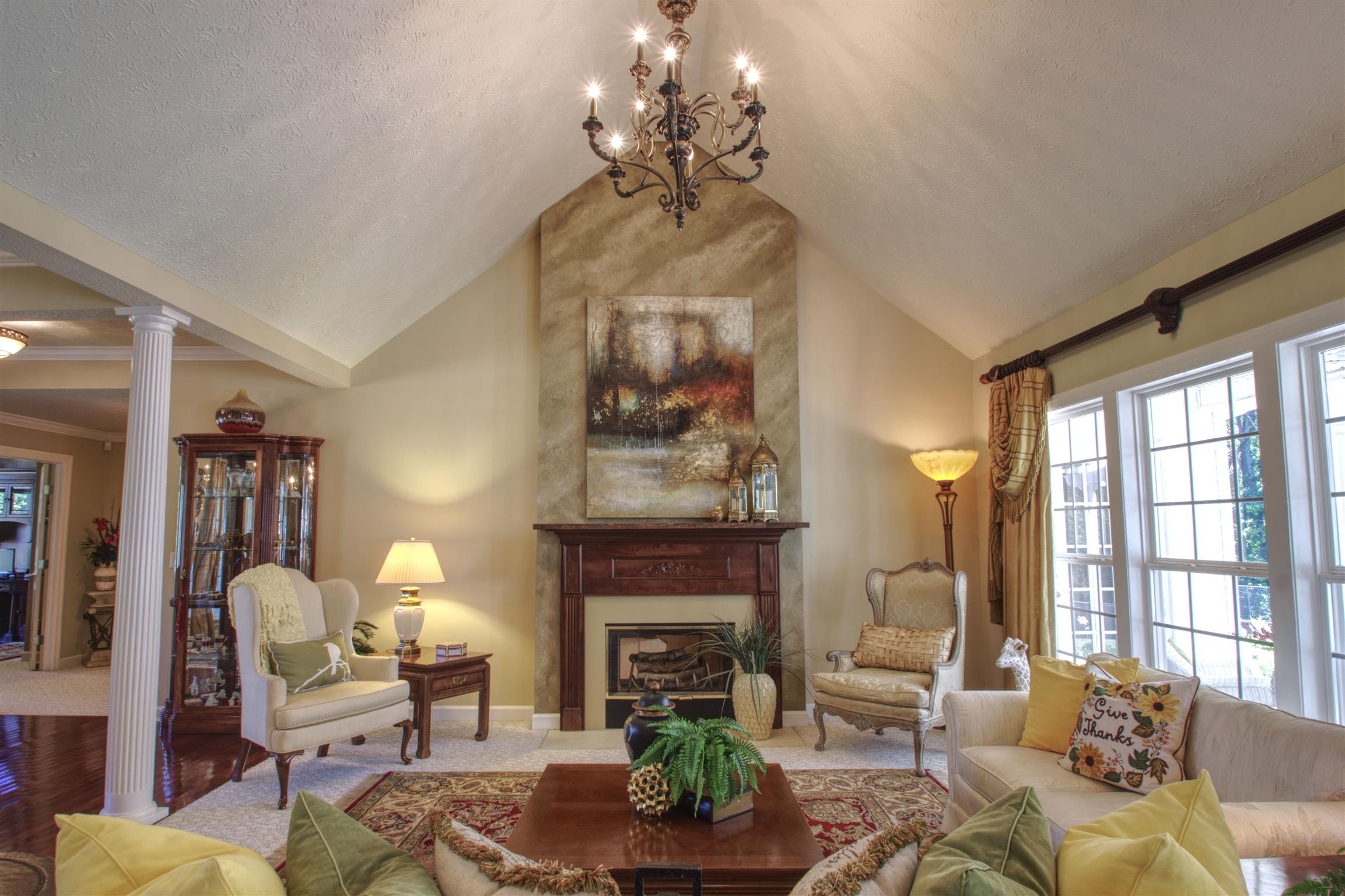 7177 Hall Road Greenbrier, TN 37073 - Photo 9 of 30 a living room with furniture a fireplace and a chandelier