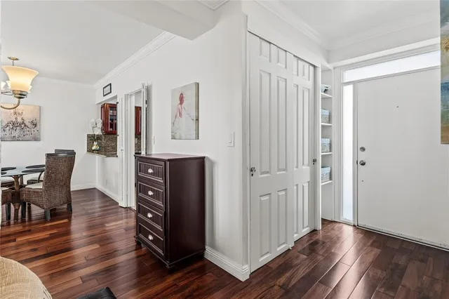 a living room with furniture a flat screen tv and a large window