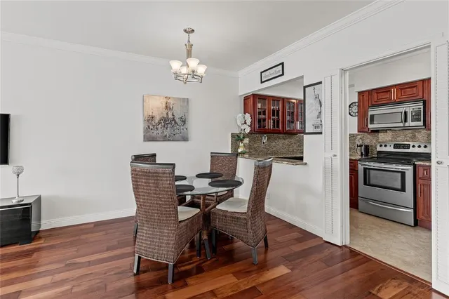 a kitchen with a stove a refrigerator and a sink