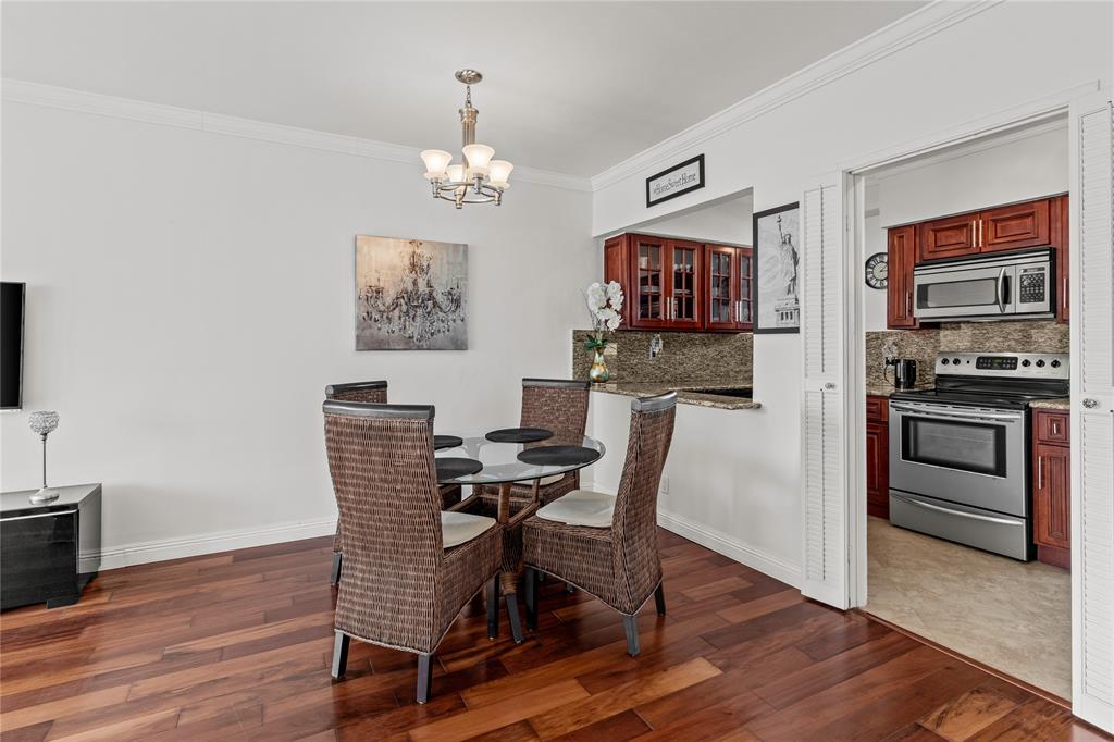 1900 South Ocean Drive, Unit 503 Fort Lauderdale, FL 33316 - Photo 14 of 33 a view of a dining room with furniture and wooden floor