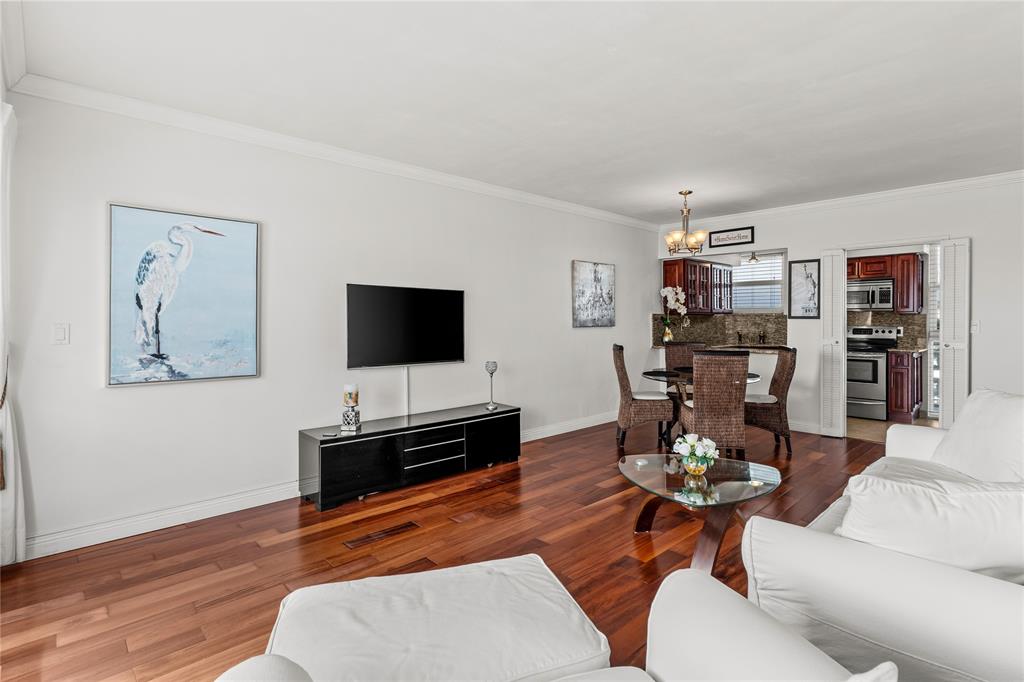 1900 South Ocean Drive, Unit 503 Fort Lauderdale, FL 33316 - Photo 19 of 33 a living room with furniture and a flat screen tv