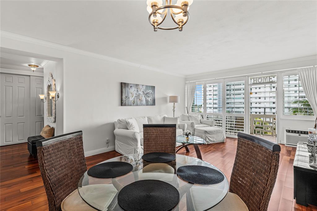 1900 South Ocean Drive, Unit 503 Fort Lauderdale, FL 33316 - Photo 20 of 33 a workspace with furniture a large window and wooden floor