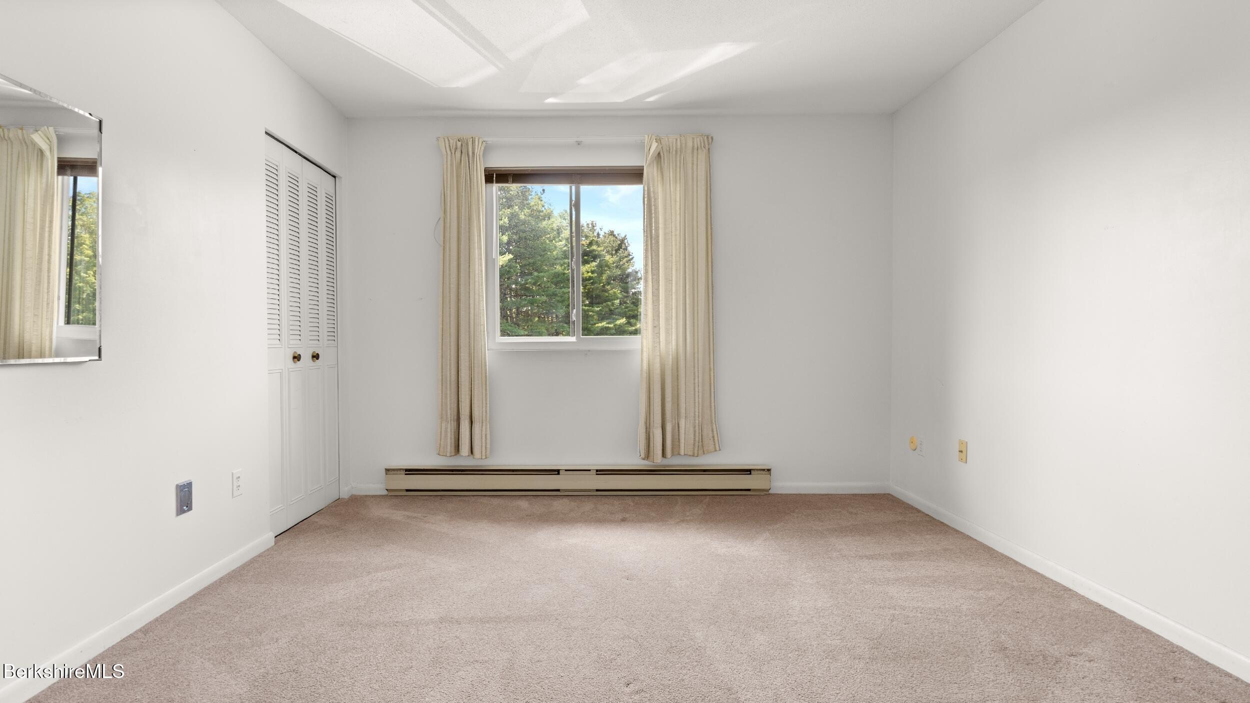 26 Churchill Crest Pittsfield, MA 01201 - Photo 9 of 16 an empty room with a window