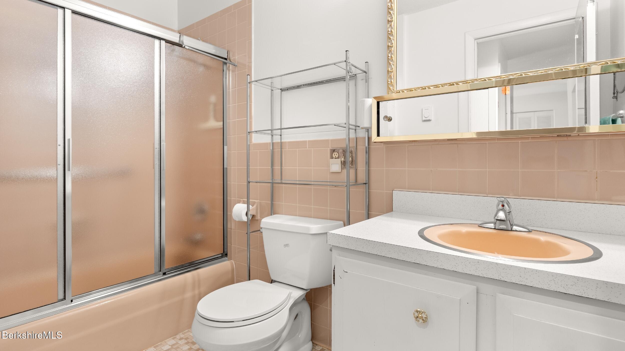 26 Churchill Crest Pittsfield, MA 01201 - Photo 10 of 16 a bathroom with a sink a toilet and shower