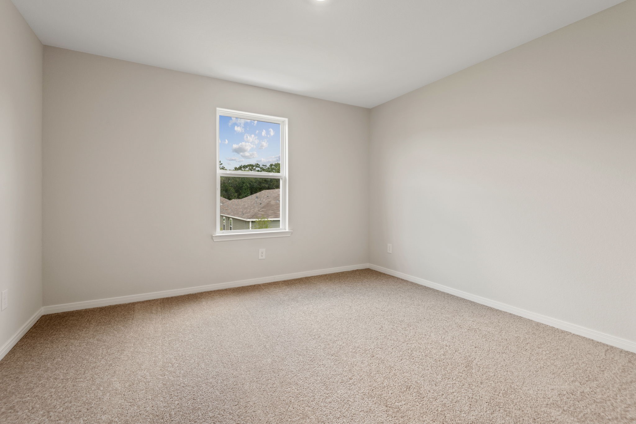 10414 Red Cardinal Drive Cleveland, TX 77328 - Photo 13 of 22 a view of an empty room with a window