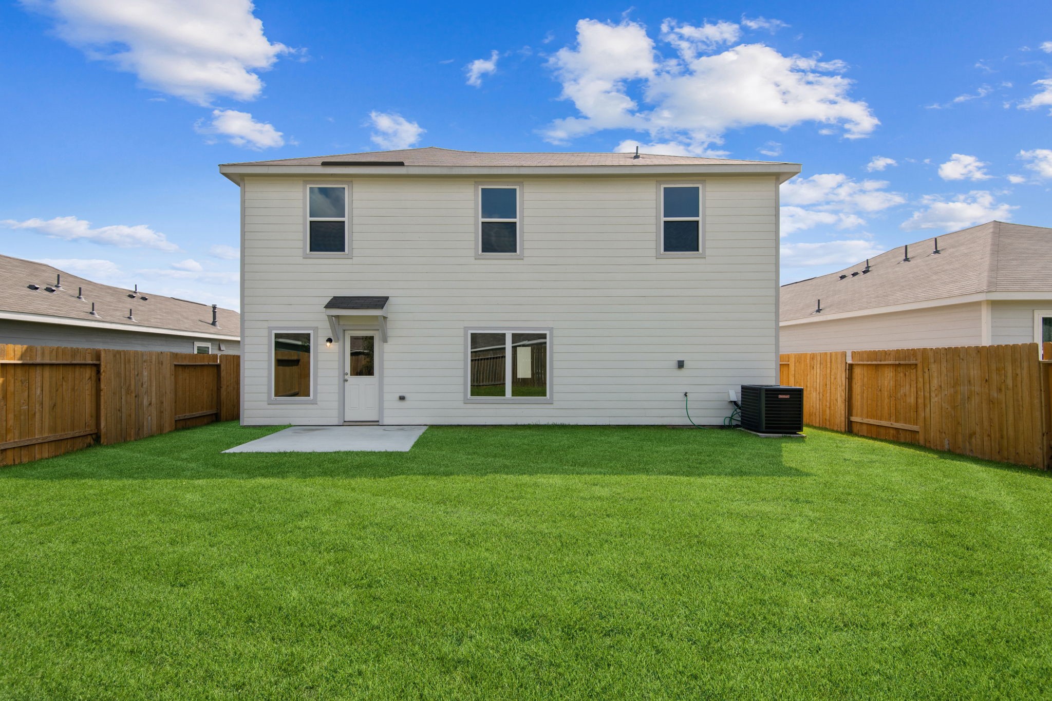 10414 Red Cardinal Drive Cleveland, TX 77328 - Photo 2 of 22 a view of a backyard with plants and a garden