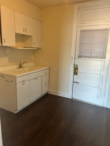 a view of storage and utility room with closet