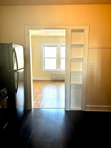 a view of an empty room with a window