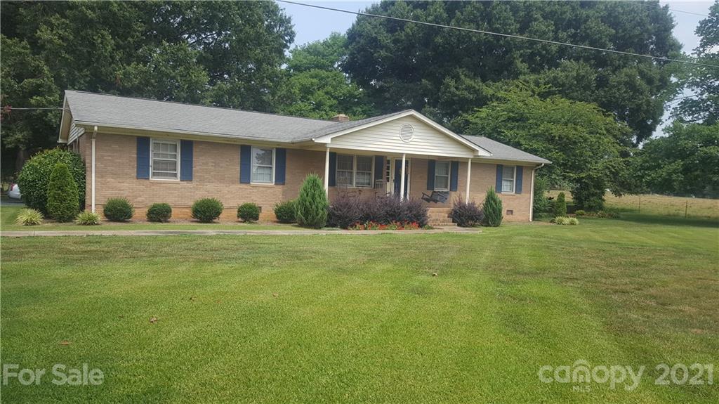 6417 Morgan Mill Road Monroe, NC 28110 - Photo 1 of 1 a front view of a house with garden