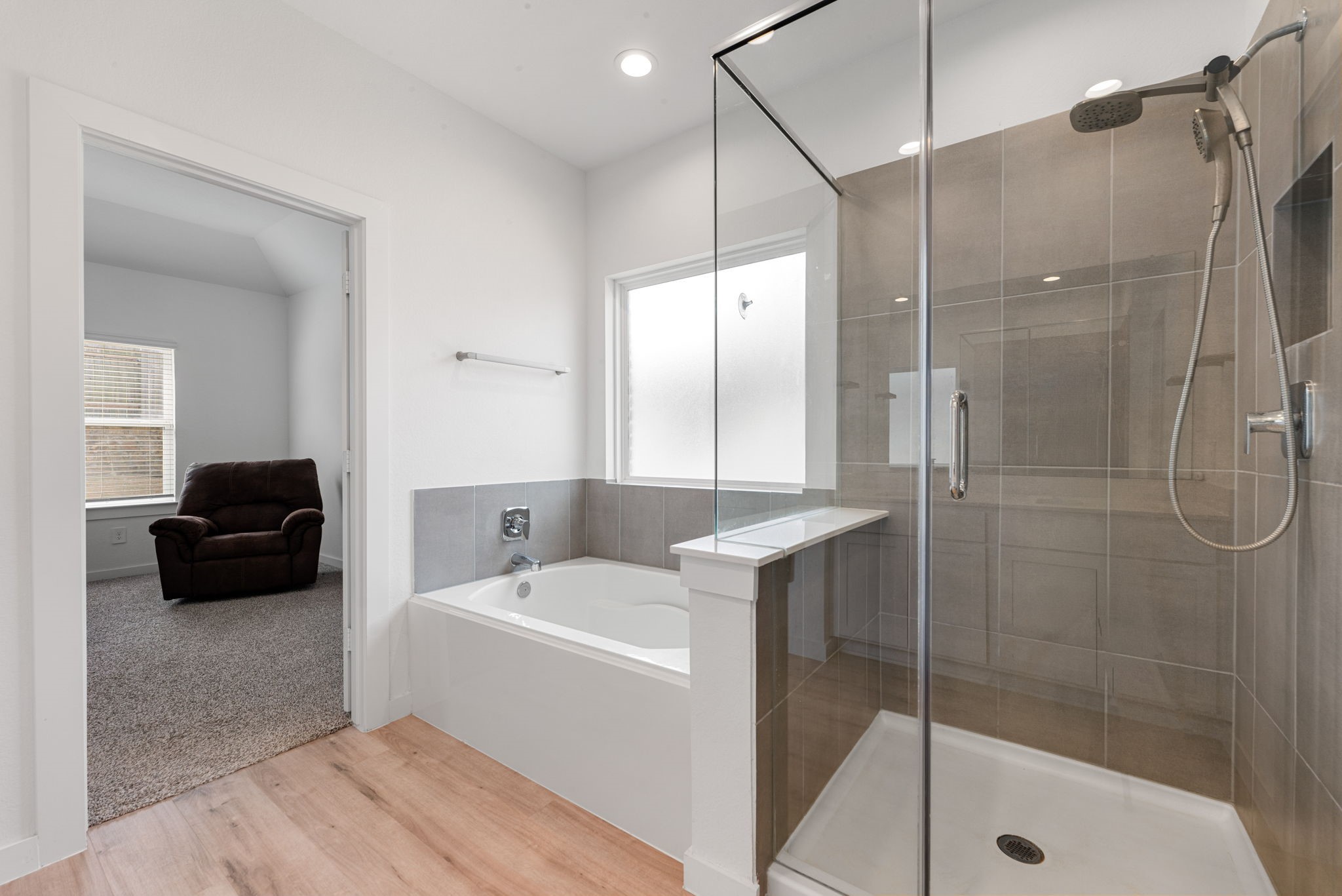 14019 Valley Creek Conroe, TX 77384 - Photo 12 of 30 a bathroom with a tub shower sink and mirror