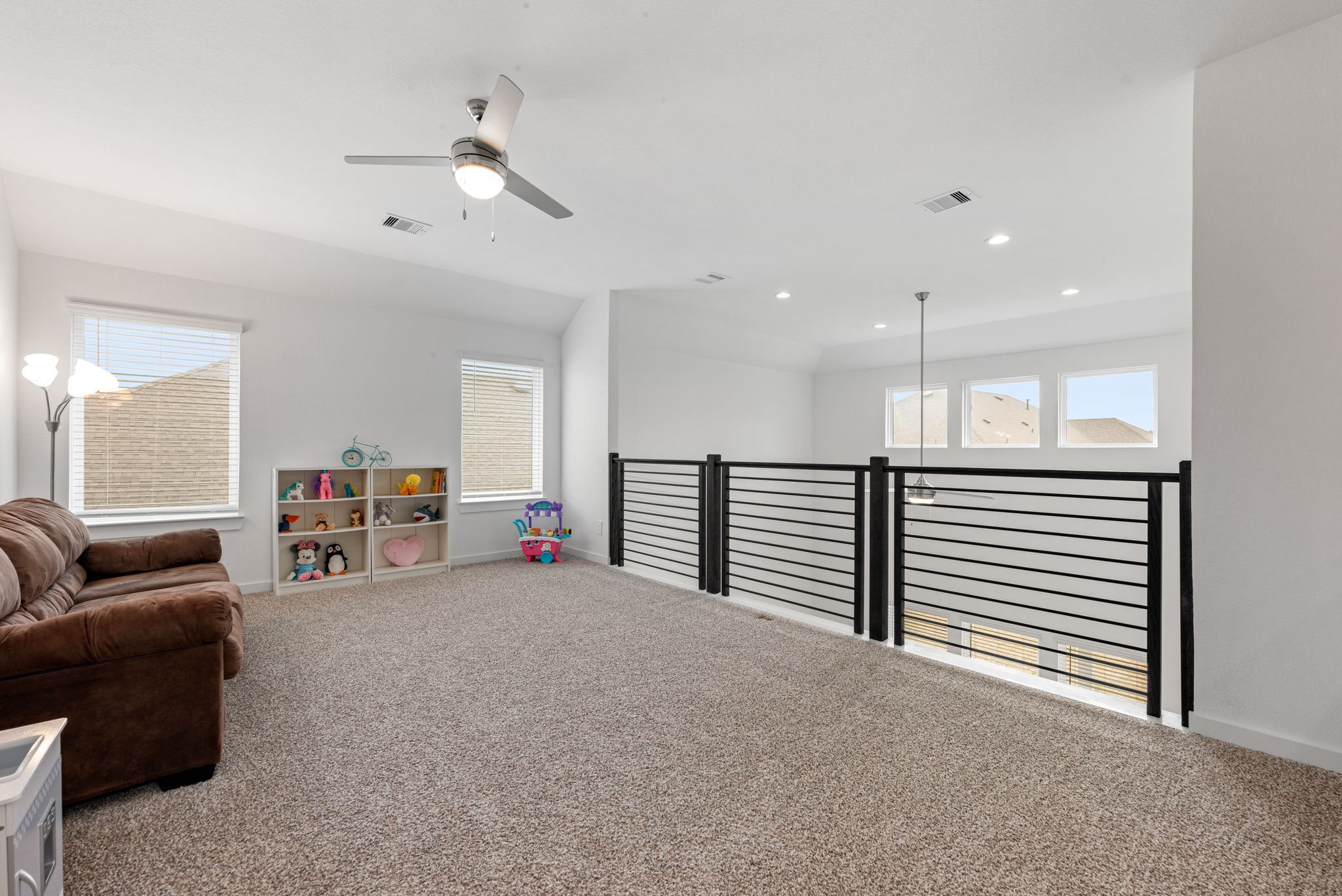 14019 Valley Creek Conroe, TX 77384 - Photo 15 of 30 a view of a livingroom with furniture and a ceiling fan