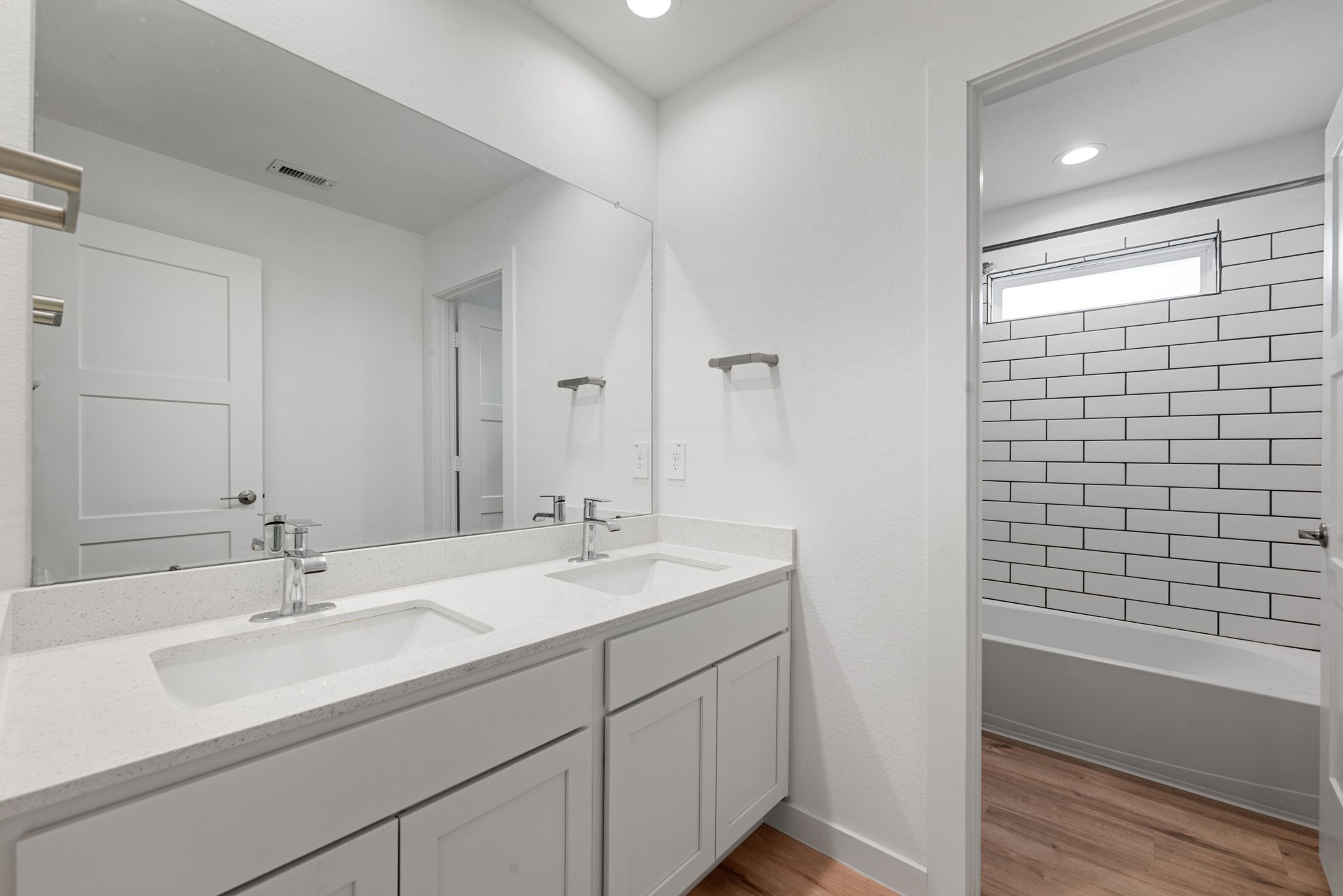 14019 Valley Creek Conroe, TX 77384 - Photo 18 of 30 a bathroom with a sink double vanity and shower