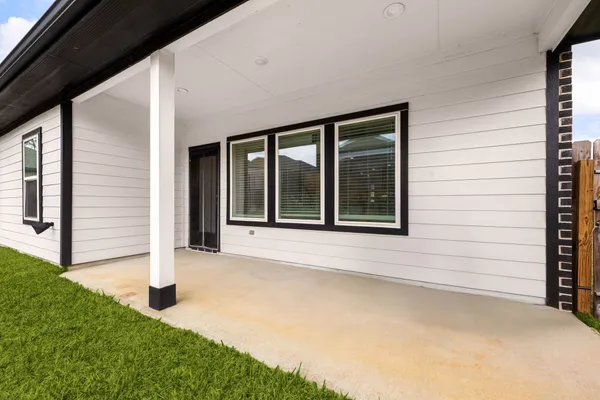 a view of house with backyard