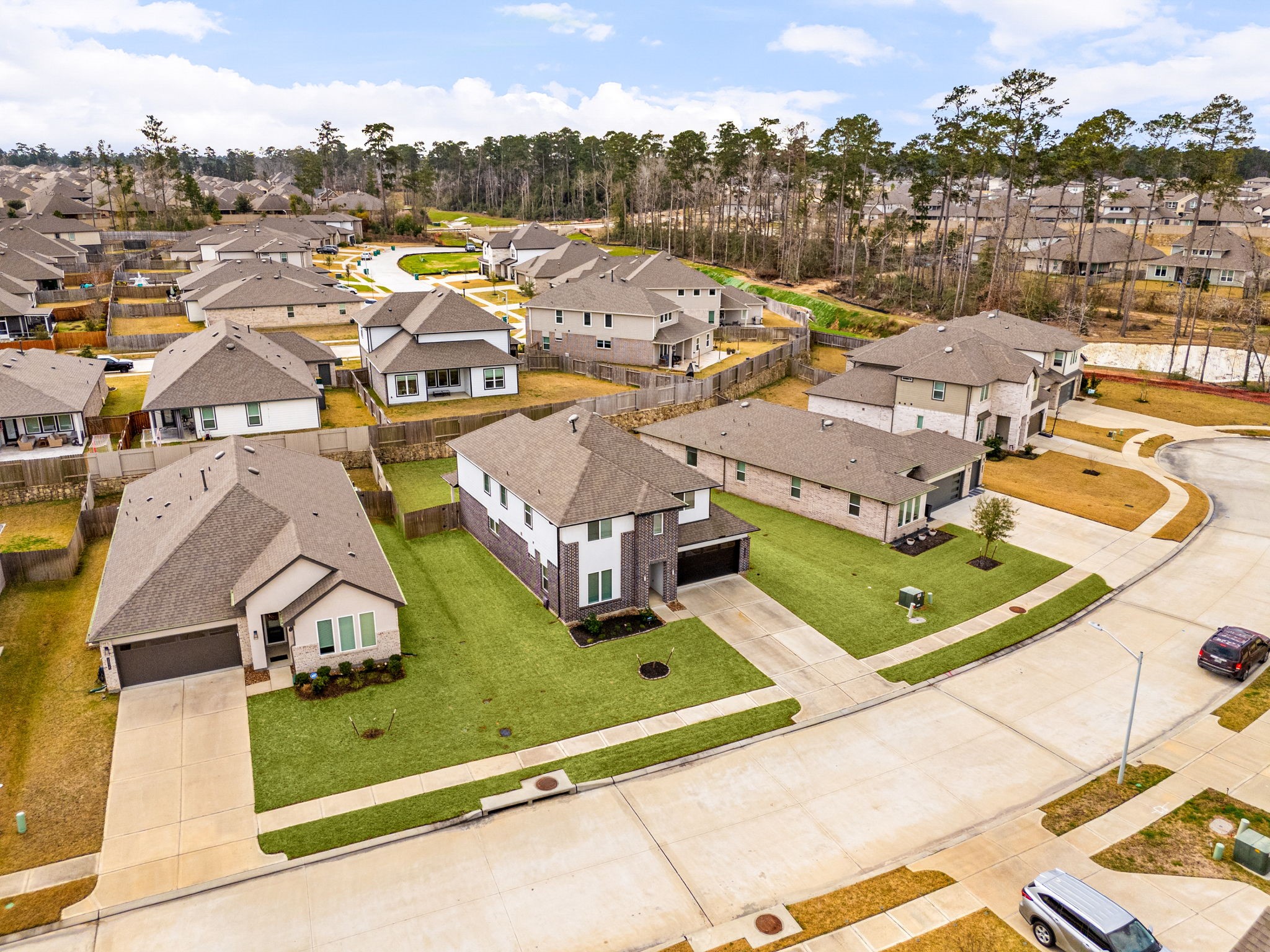 14019 Valley Creek Conroe, TX 77384 - Photo 25 of 30 an aerial view of residential houses with outdoor space