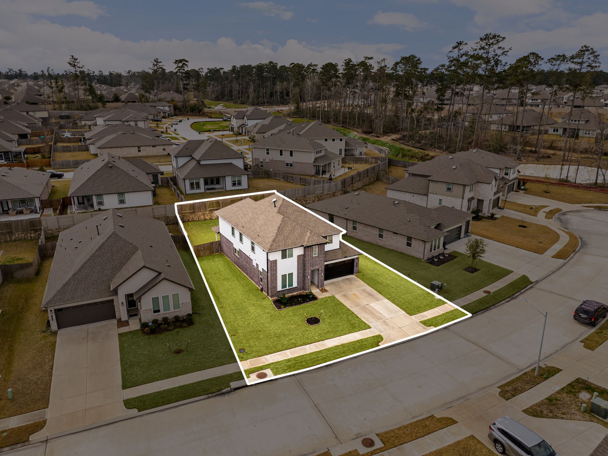 14019 Valley Creek Conroe, TX 77384 - Photo 26 of 30 an aerial view of a house with a swimming pool