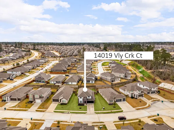 an aerial view of residential building with parking space