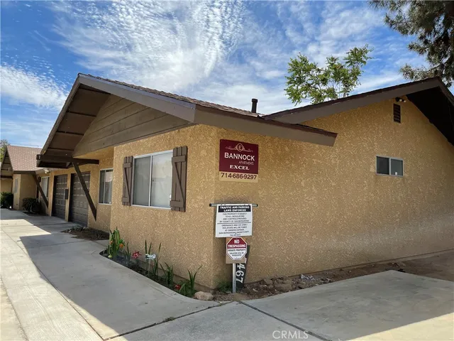 a front view of a house with a garage