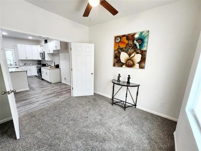 a view of kitchen with cabinets and wooden floor