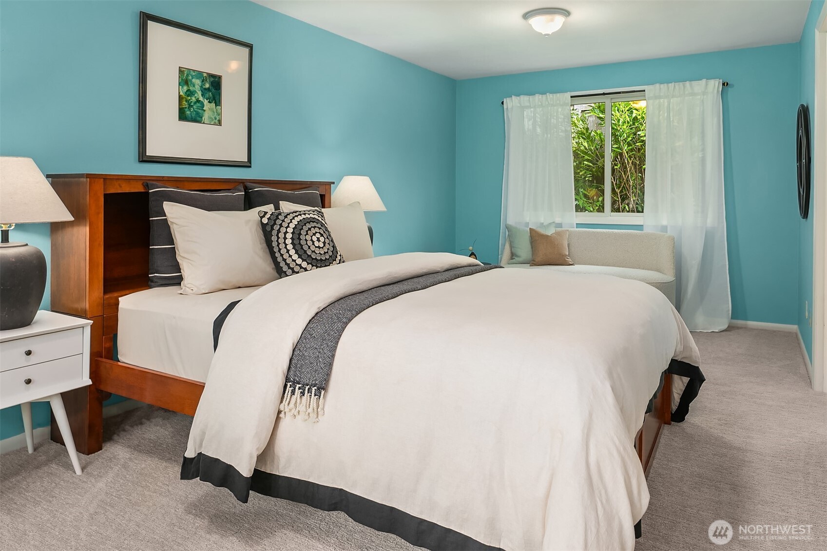 6555 Northeast Windermere Road Seattle, WA 98105 - Photo 26 of 40 a spacious bedroom with a bed and a window