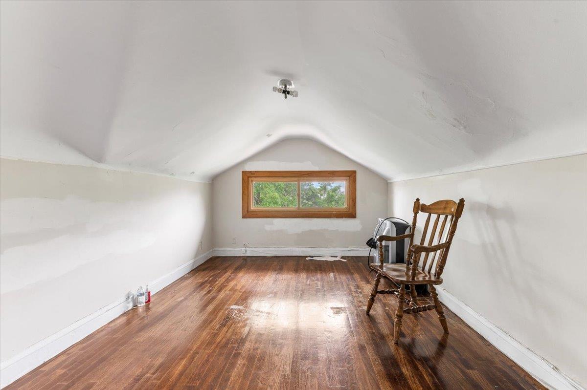 345 Broadway Lawrence, NY 11559 - Photo 18 of 25 a workspace room with wooden floor lounge chair and windows