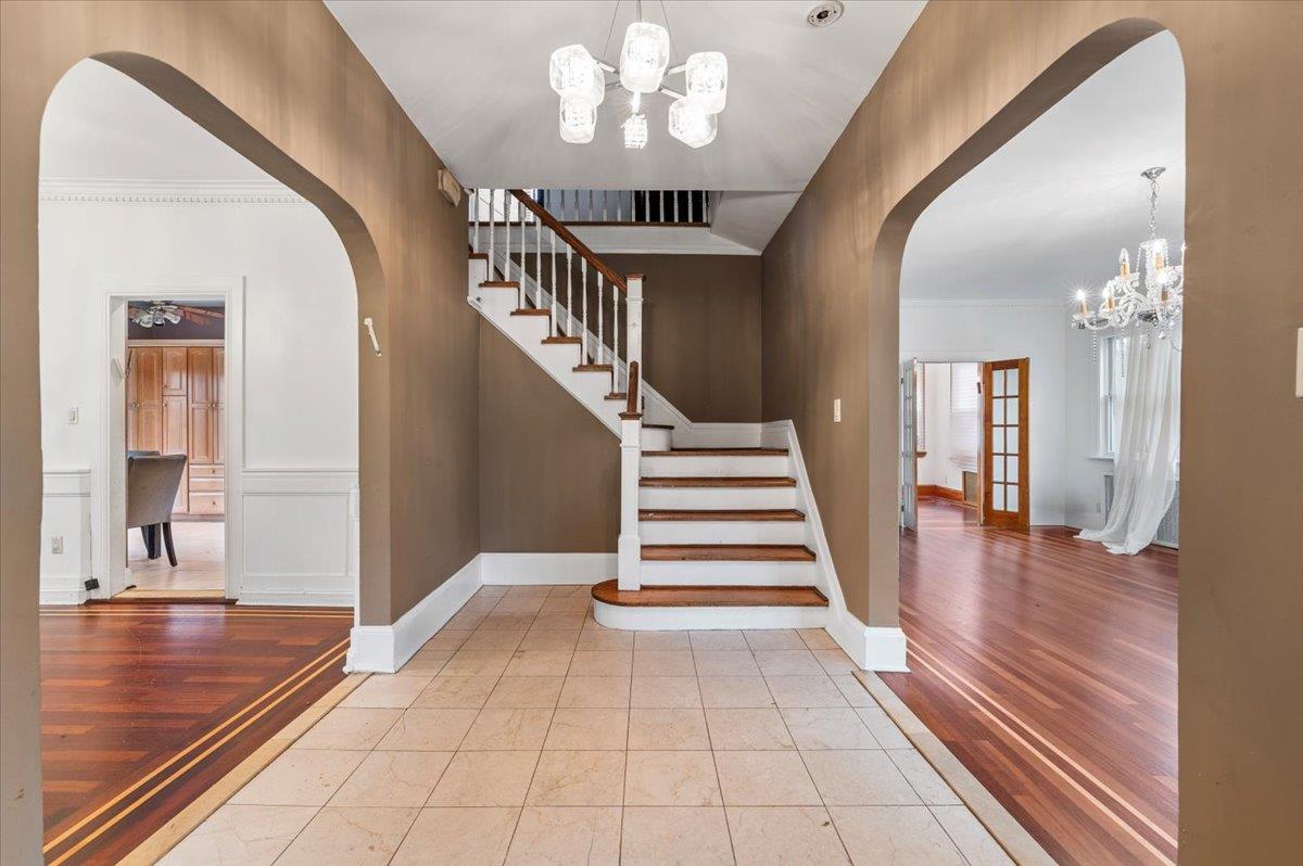 345 Broadway Lawrence, NY 11559 - Photo 3 of 25 a view of entryway and hall with wooden floor