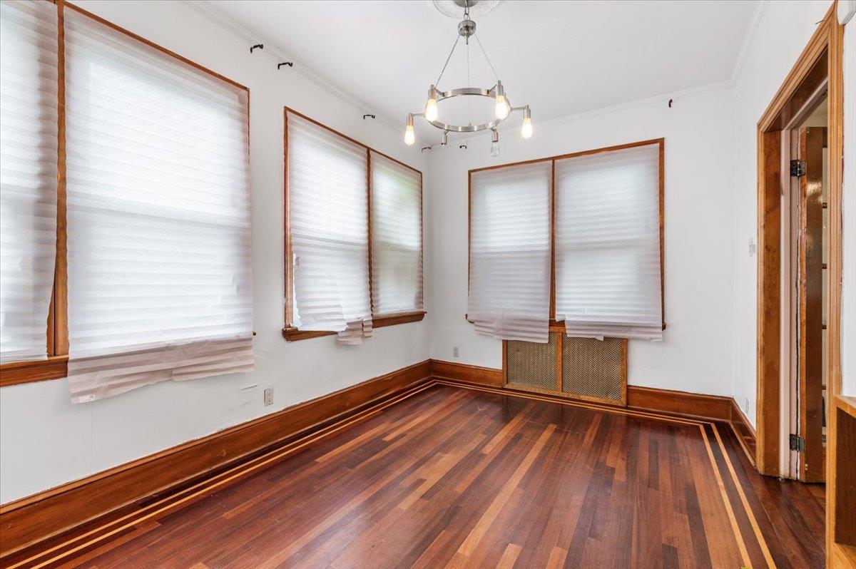 345 Broadway Lawrence, NY 11559 - Photo 7 of 25 a view of an empty room with wooden floor and a window