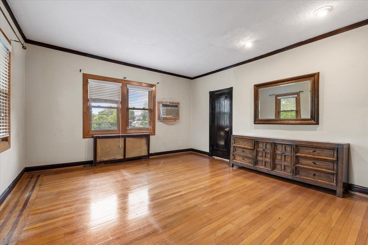 345 Broadway Lawrence, NY 11559 - Photo 10 of 25 wooden floor in an empty room with a window