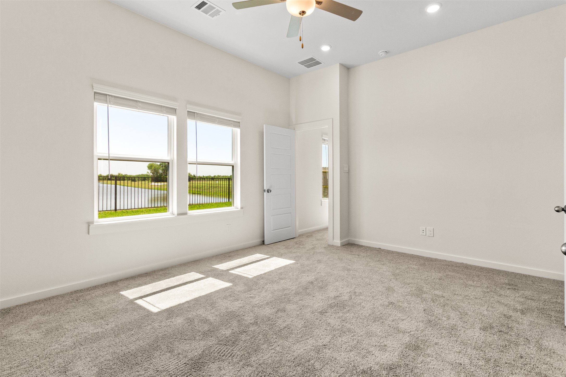 6643 Escondido Drive Rosharon, TX 77583 - Photo 11 of 25 an empty room with windows