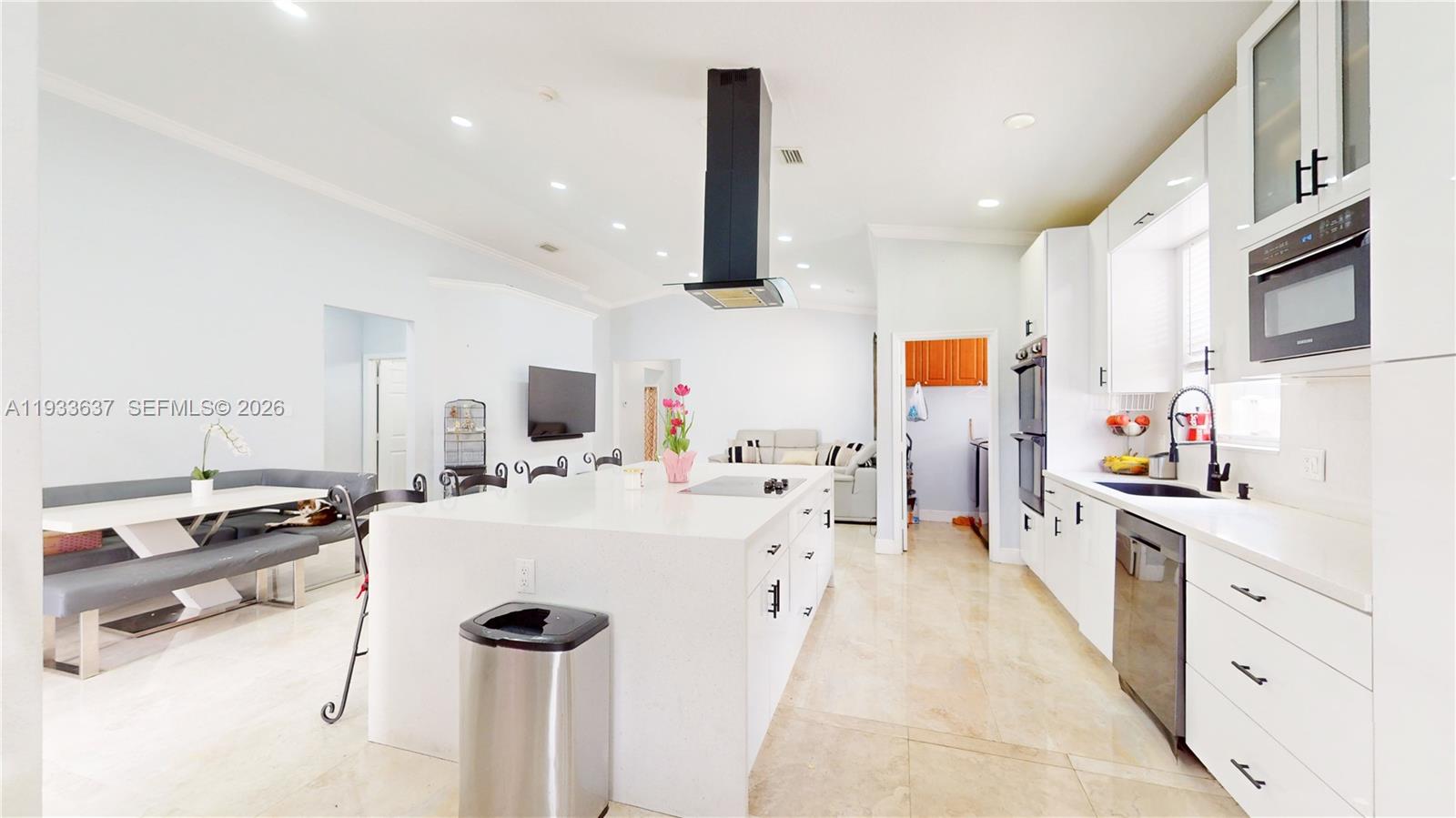13877 Southwest 50th Street Miramar, FL 33027 - Photo 19 of 54 a kitchen with stainless steel appliances a sink stove and refrigerator