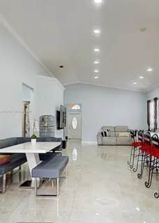 a living room with furniture and a table