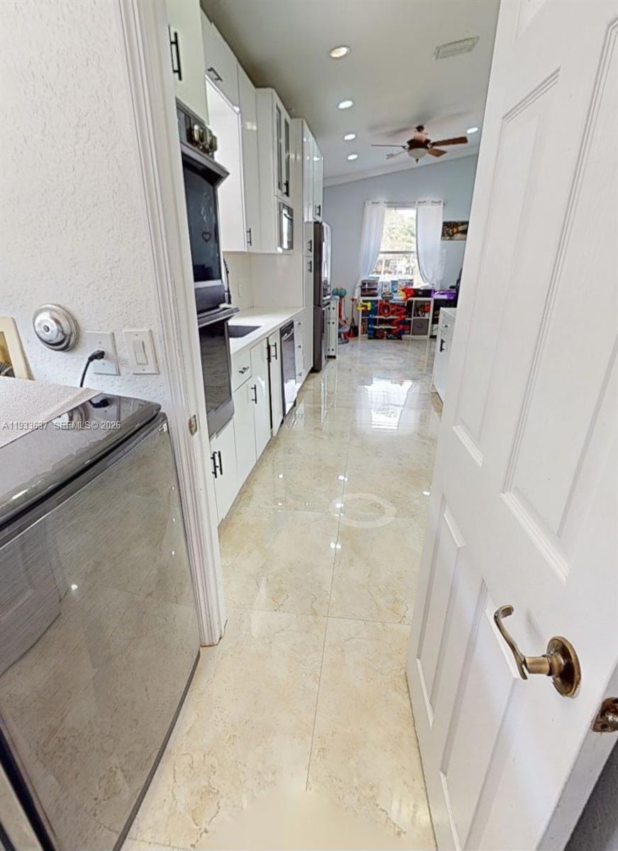 13877 Southwest 50th Street Miramar, FL 33027 - Photo 24 of 54 a view of storage and utility room